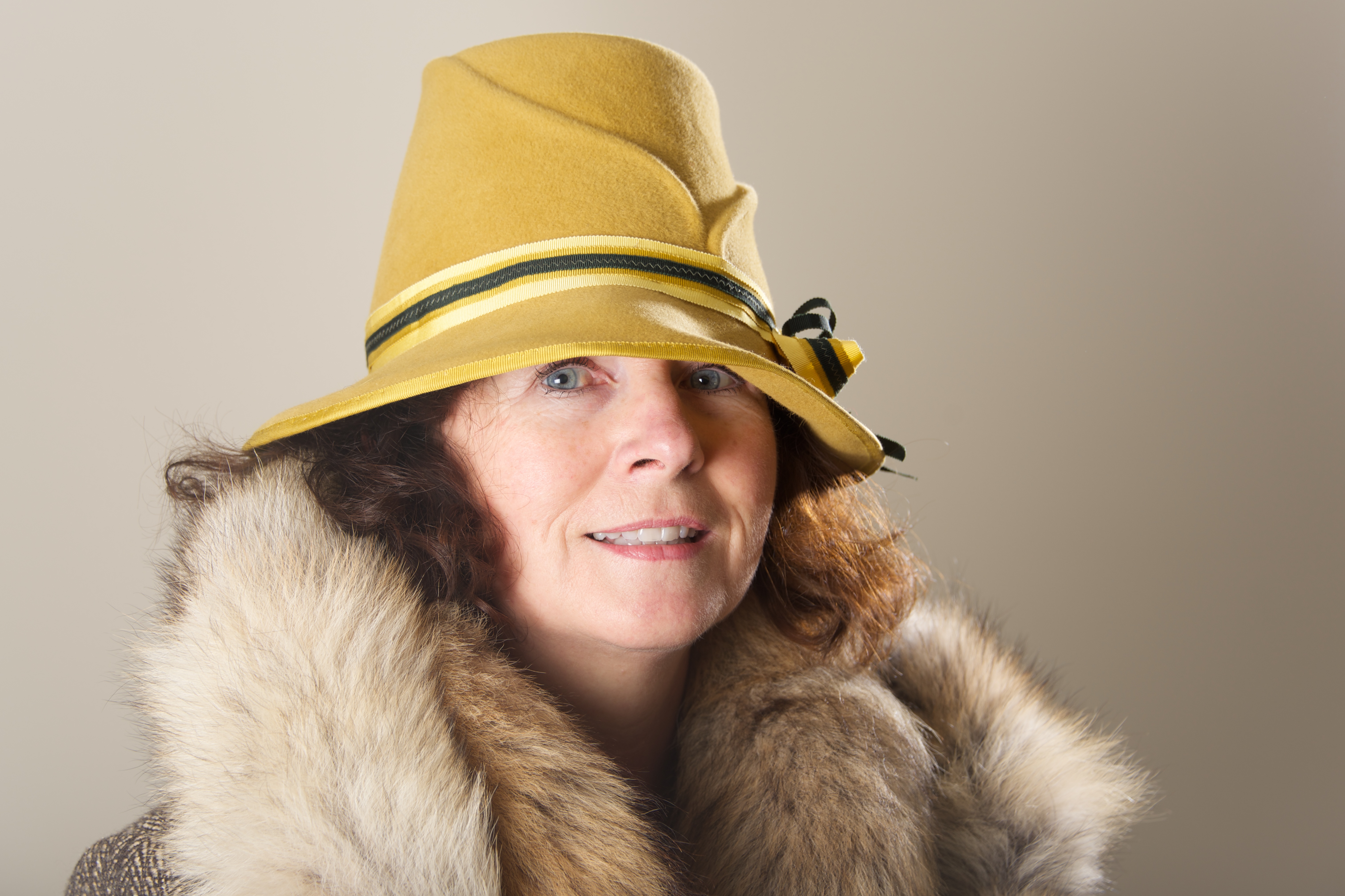 in yellow felt hat and fur Nick Dale Private Tutor
